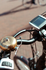 Obraz premium View of the front of an electric bicycle on a Dutch street, an other bike in the distance