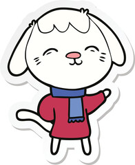 sticker of a happy cartoon dog in winter clothes