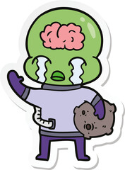 sticker of a cartoon big brain alien crying and waving goodbye