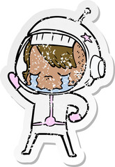distressed sticker of a cartoon crying astronaut girl