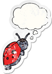 cute cartoon ladybug and thought bubble as a distressed worn sticker
