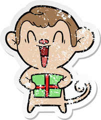 distressed sticker of a cartoon laughing monkey