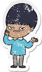 Obraz premium distressed sticker of a annoyed cartoon boy