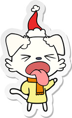 sticker cartoon of a dog wearing scarf and pullover wearing santa hat