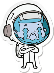 sticker of a cartoon crying astronaut