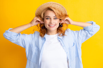 Cherry earrings. Portrait of woman with cherries on yellow studio isolated background.