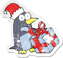 retro distressed sticker of a cartoon christmas penguin