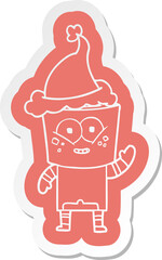 happy cartoon  sticker of a robot waving hello wearing santa hat