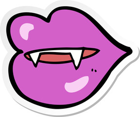 sticker of a cartoon vampire fangs