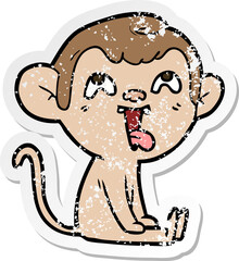 distressed sticker of a crazy cartoon monkey