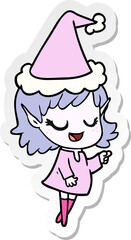 happy sticker cartoon of a elf girl pointing wearing santa hat