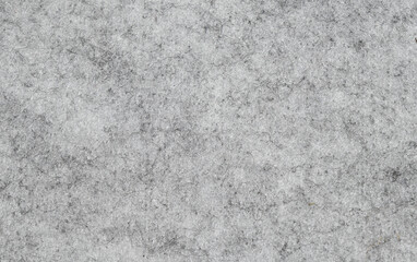 Natural gray felt background. Close-up surface structure, macro photography of the material