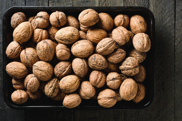 Walnuts in a baking tray.