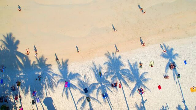 Despite its popularity among tourists, Haad Rin still retains a laid-back, relaxed atmosphere, making it a great place to escape the crowds and soak up the sun. (Koh Phangan, Thailand). 4K Drone
