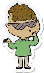 sticker of a cartoon boy wearing sunglasses