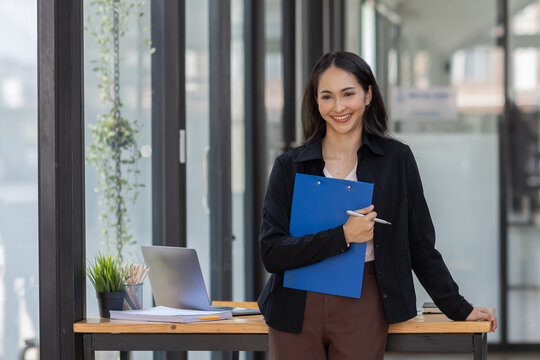 Portrait of Young indian business asian woman standing in workplace office  finance business concept.