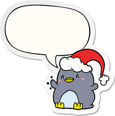 cartoon penguin wearing christmas hat and speech bubble sticker