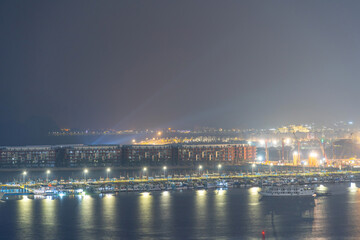 Fototapeta premium Colorful night view of Bai Chay Bridge, connecting two parts of Ha Long City, Hon Gai City and Bai Chay City through Cua Luc Bay.