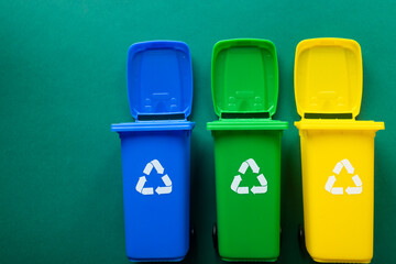 Miniature trash cans, Segregation of garbage, Different colors depending on the type of waste, Plastic, paper, bio waste, Copy space, Environmental concept