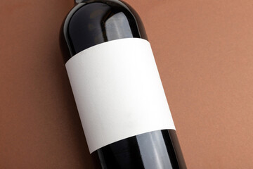 a bottle of red wine with a blank label