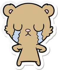 sticker of a crying cartoon bear