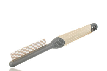 One comb for a dog, close-up, isolated on a white background.