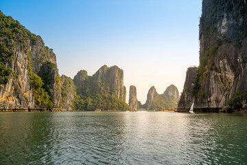 View of Ha Long Bay; with a lot of limestone islets and cruise ships; on summer day.