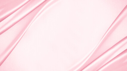 Pink rose peach white silk satin. Creases in fabric. Light luxury elegant background with space for design. Table top view, flat lay. Birthday, baby, newborn. Or a wedding, valentine. Romance, tender.