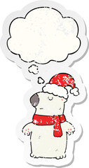 cute cartoon christmas bear and thought bubble as a distressed worn sticker