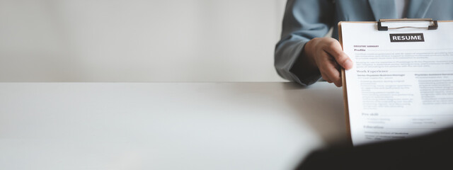 Person submitting resume to interview for a job with a company, Person attending a job interview with a manager to be recruited to the company for the position applied for. Job application concept.