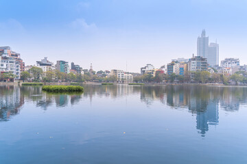 Fototapeta na wymiar West lake and Truc Bach lake in foggy morning, Hanoi city, Vietnam. Travel and landscape concept.