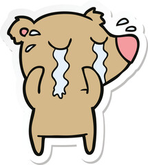 sticker of a cartoon crying bear