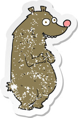 retro distressed sticker of a cartoon bear