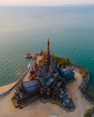 Sanctuary of Truth, Pattaya, Thailand, wooden temple by the ocean at sunset on the beach of Pattaya