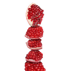 Stacked pieces of pomegranate on white background