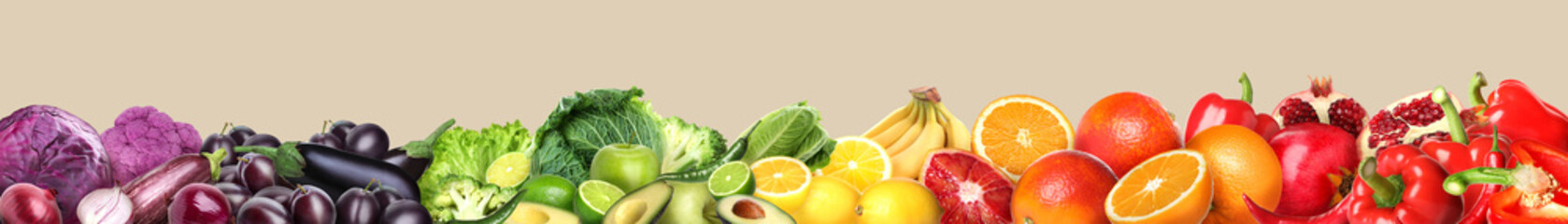 Many different fresh fruits and vegetables on beige background. Banner design