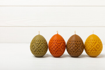 Easter eggs candles. easter bunny and willow branches on white texture background. Easter holiday concept. Spring bouquet of willow. Decor for home and holiday table. Copy space. Place for text.