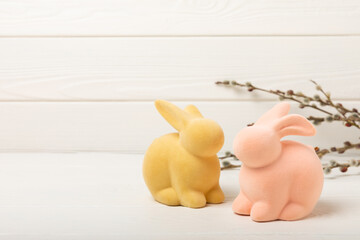 Easter decor. easter bunny and willow branches on white texture background. Easter holiday concept....