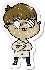 distressed sticker of a cartoon boy wearing spectacles