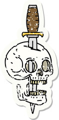 traditional distressed sticker tattoo of a skull and dagger
