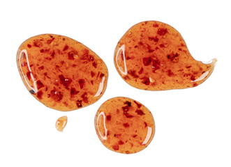 Drops of sour sweet sauce with pieces chilli pepper isolated on transparent background, PNG