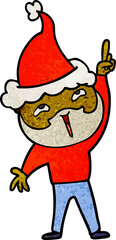 textured cartoon of a happy bearded man wearing santa hat