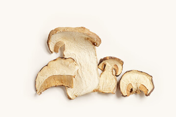 Dry slices of porcini as trend food pattern, square composition from boletus mushrooms, top view, flat lay, beige pastel aesthetic monochrome photo. Gourmet food ingredient, vegetable organic protein