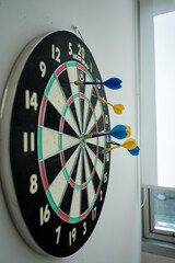 dart board with darts, targeting 