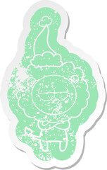 cartoon distressed sticker of a tired lion wearing santa hat