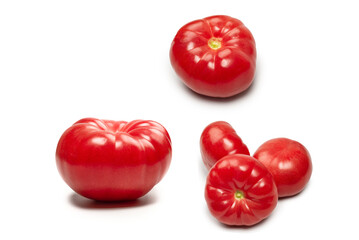 Red fresh tomato isolated on white background.