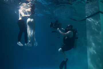 filming a movie underwater underwater cameraman and actors