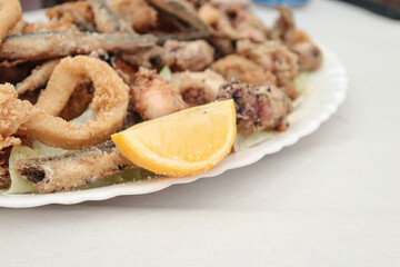 fried sea food with lemon. Mediterranean diet