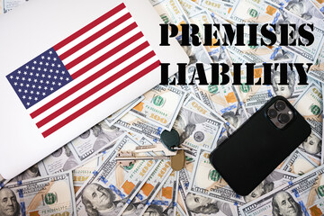Premises liability concept. USA flag, dollar money with keys, laptop and phone background.