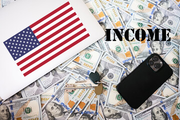 Income concept. USA flag, dollar money with keys, laptop and phone background.